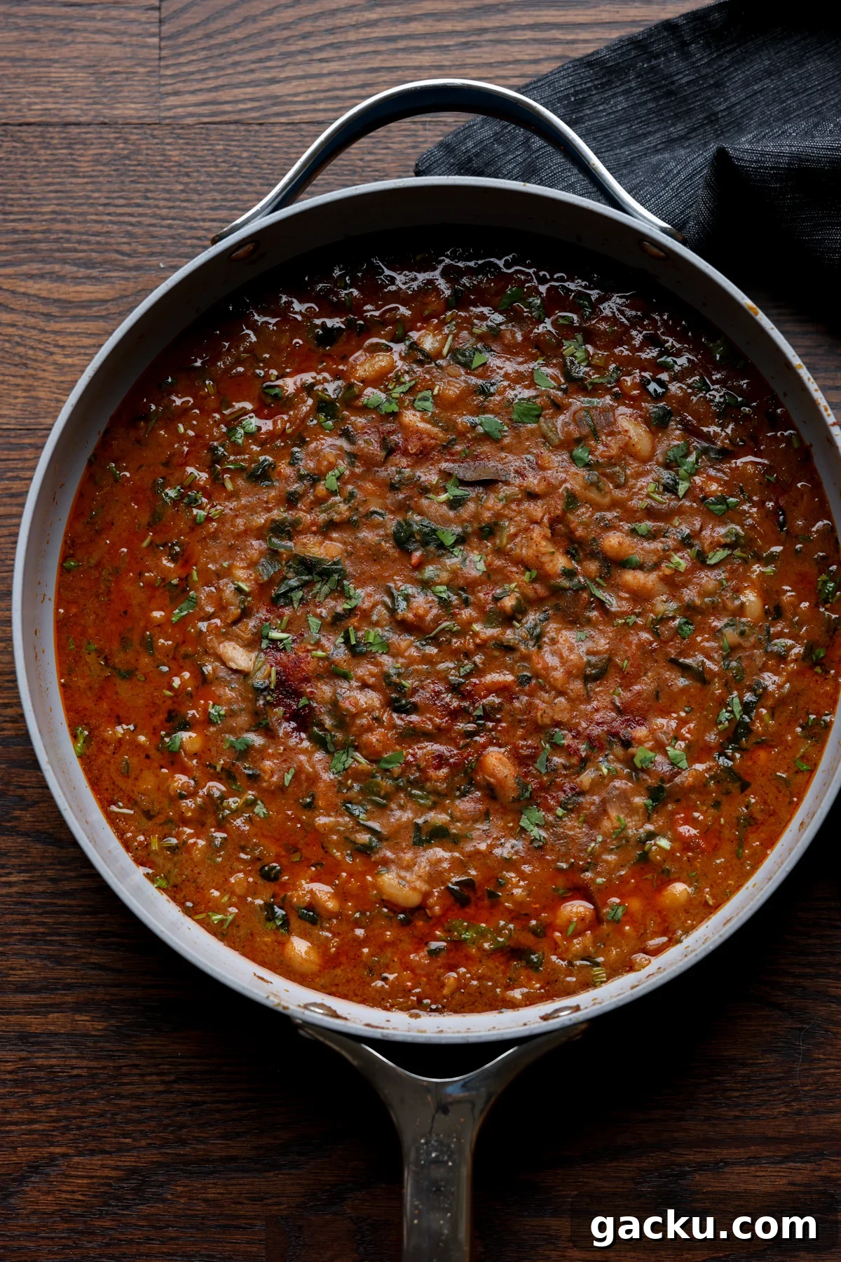 lentil bean stew in the pan after cooking and garnishing