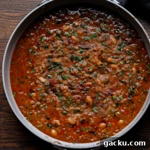 lentil bean stew in the pan after cooking and garnishing