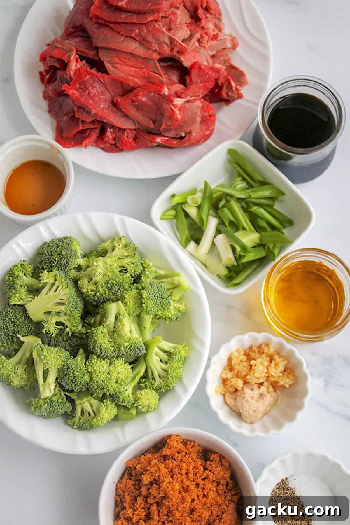 Beef and broccoli recipe stir fry ingredients on a white board.