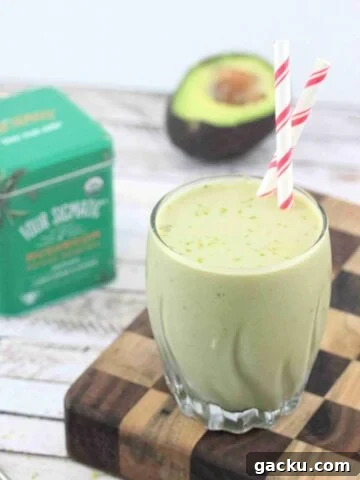 Banana matcha smoothie in a glass.