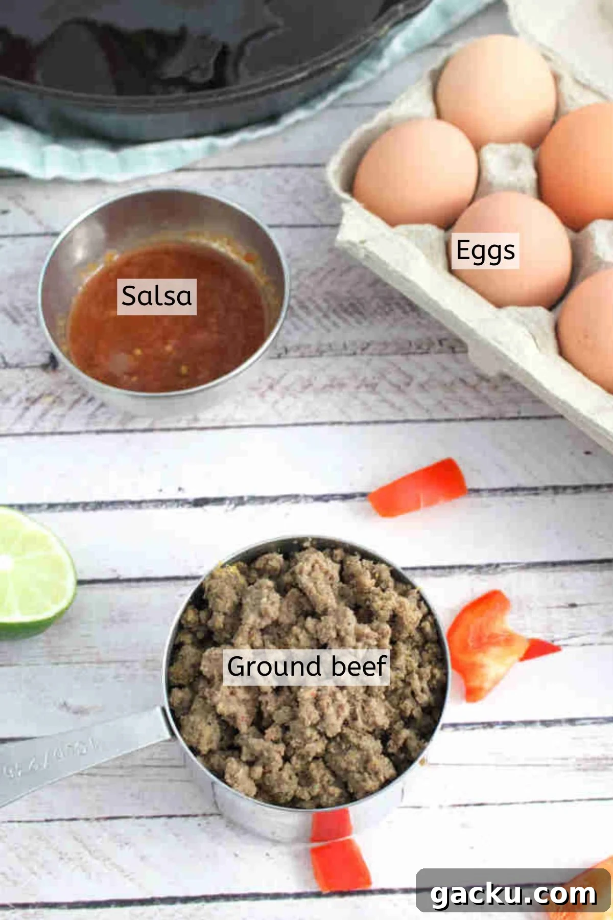 Ground beef, salsa, eggs, and peppers with text labels over the ingredients.