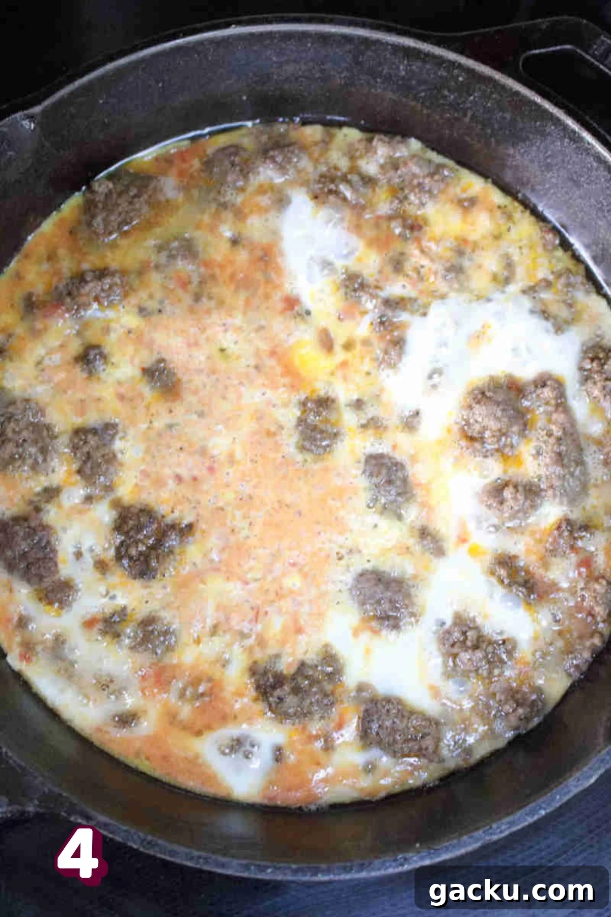 Cooked ground beef in a cast-iron skillet.