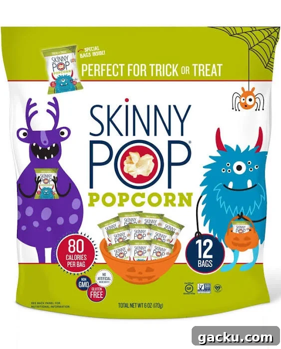 A bag of SkinnyPop Popcorn is displayed with a Halloween theme, featuring cartoon monsters and a callout that it is 'Perfect for Trick or Treat.'
