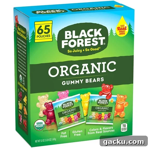 A green box of Black Forest Organic Gummy Bears is shown from a slight angle, with illustrations of gummy bears and two smaller pouches of the candy on the front.