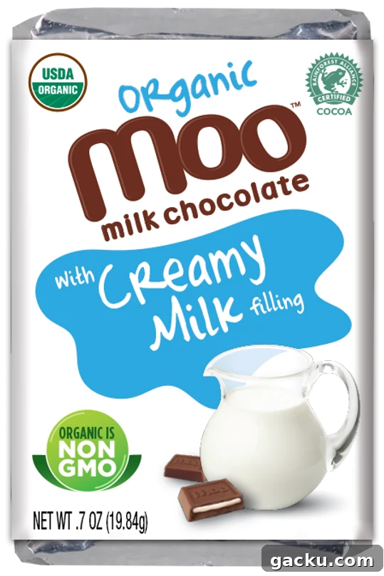 A white and green foil wrapper of organic milk chocolate from Moo Chocolate with creamy milk filling is shown from the front.