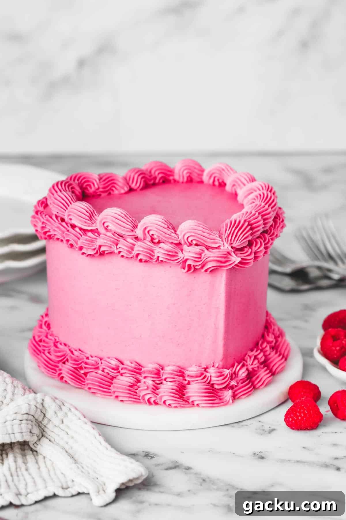 raspberry pink heart vintage cake on a table