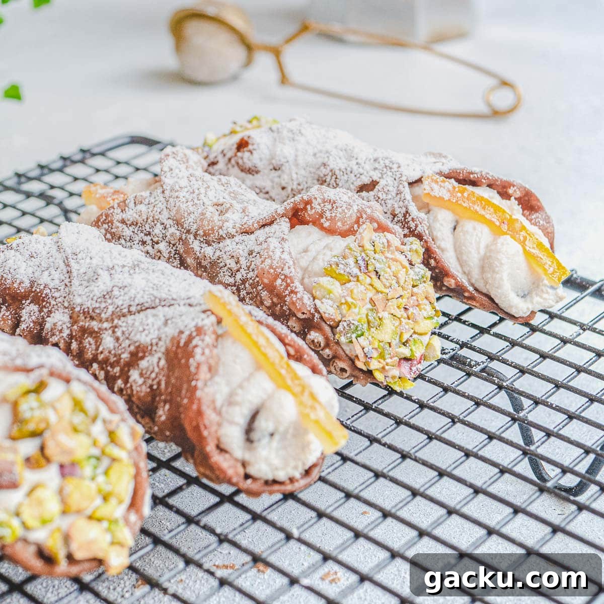 Vegan Cannoli: Crispy Shells with Creamy Ricotta-Style Filling 3 vegan cannoli topped with crushed pistachios