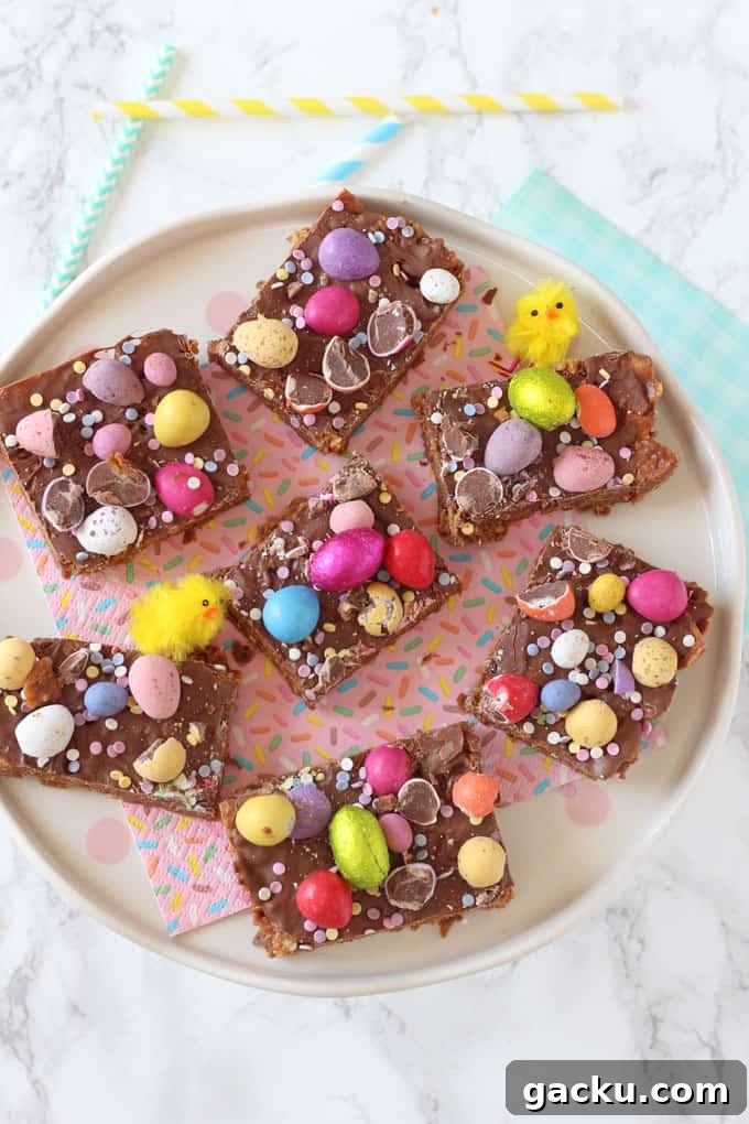 No-Bake Easter Cornflake Crunch: Kid-Friendly Holiday Treat 2 7 squares of Easter Cornflake Crunch served on a confetti themed napkin with mini easter chick decorations