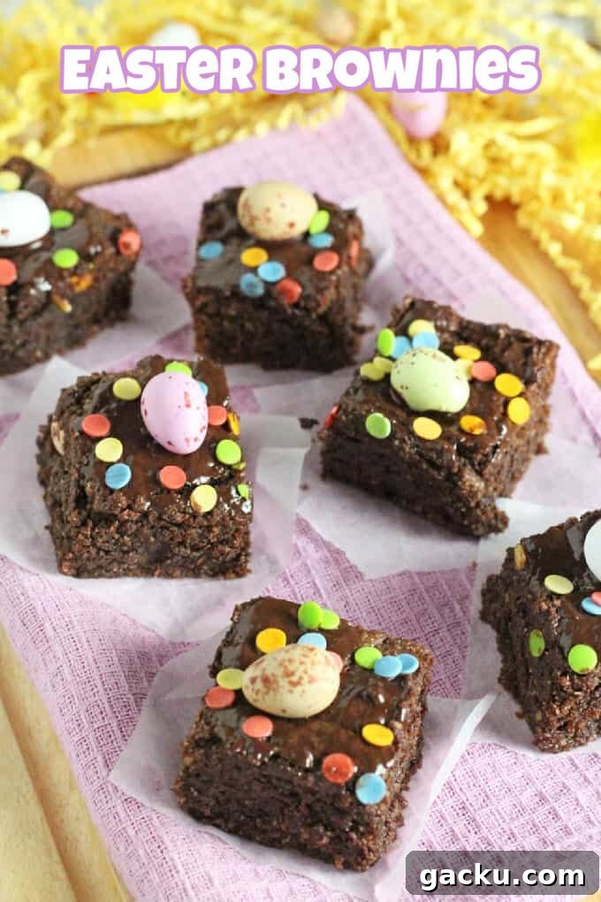 No-Bake Easter Cornflake Crunch: Kid-Friendly Holiday Treat 4 Mini Egg Brownies cut into small squares, topped with a Cadbury's mini egg and colourful sprinkles.