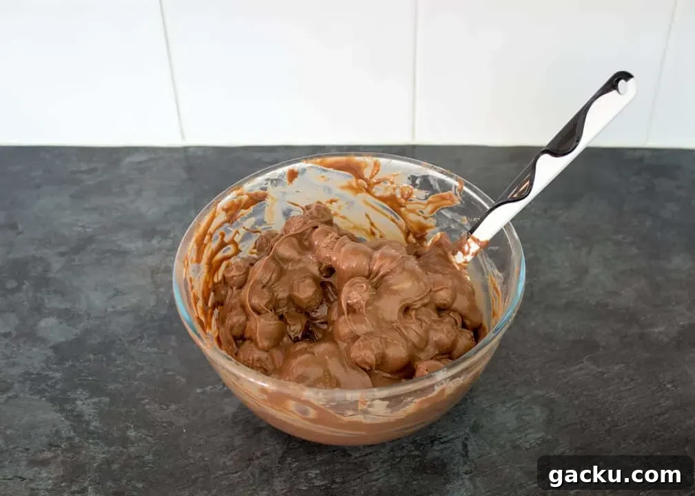 Maltesers Microwave Fudge mixture in a bowl with Maltesers mixed in