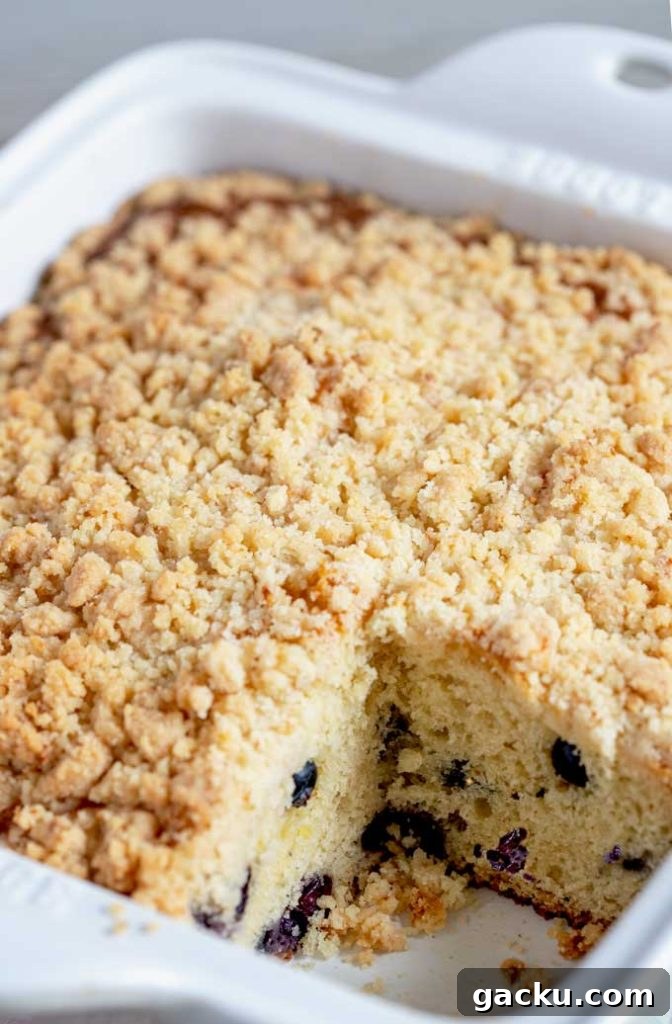 View of the crumb topping of the coffee cake inside a baking dish.