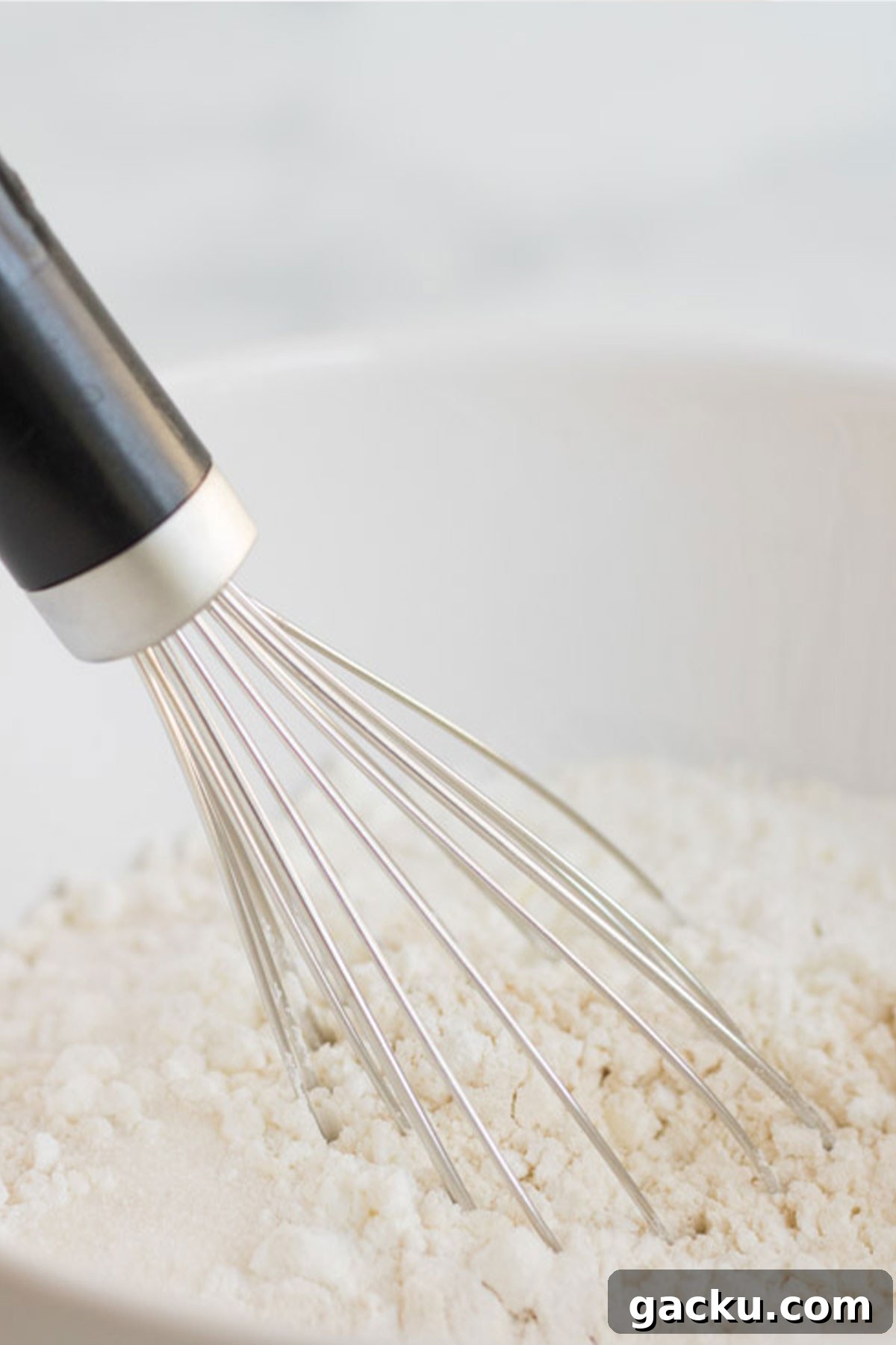 Whisking the dry ingredients in a bowl