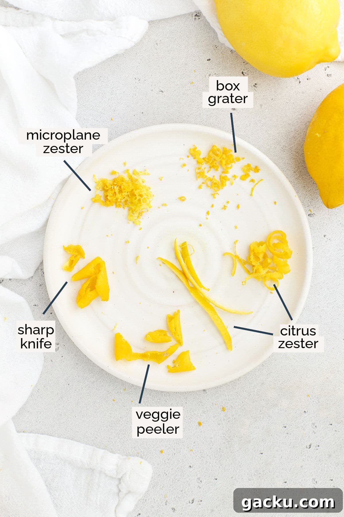 six different sizes of lemon zest on a white plate