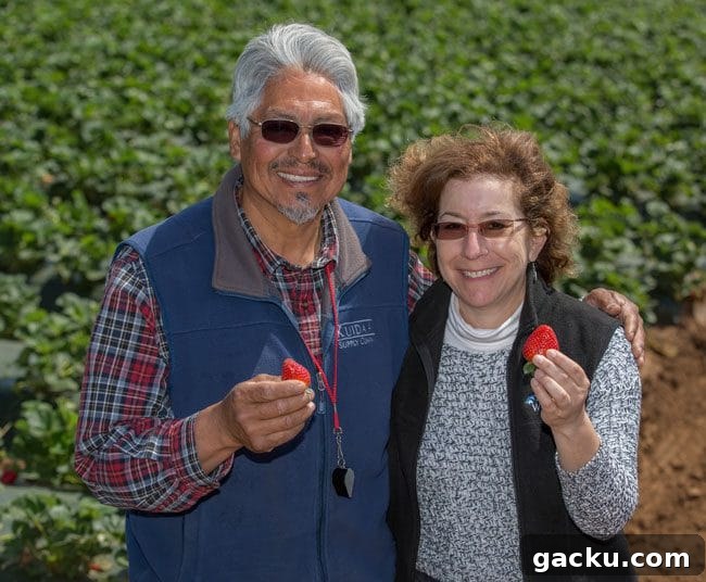 Miguel and visitor in the field