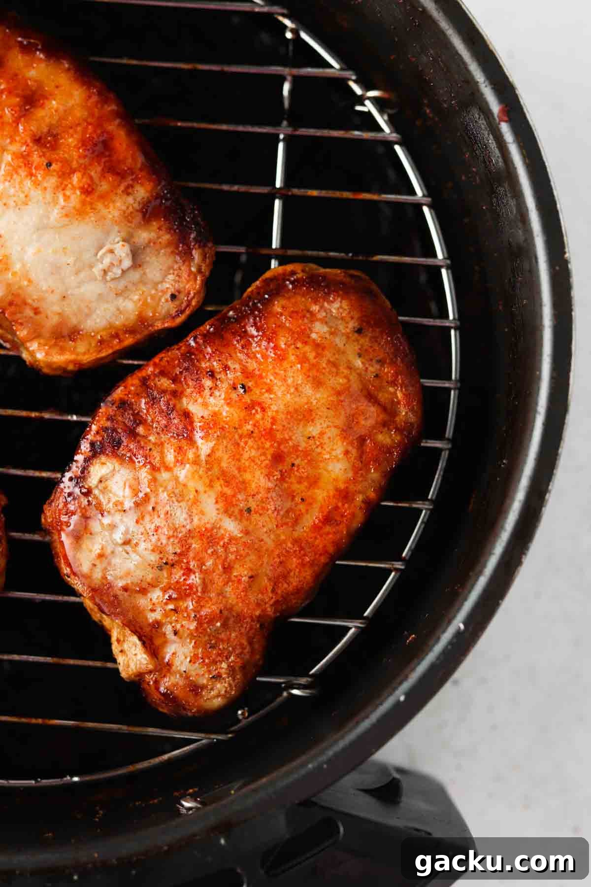 Crispy Air Fryer Pork Chops from Frozen in 20 Minutes 3 crispy pork chops in the air fryer