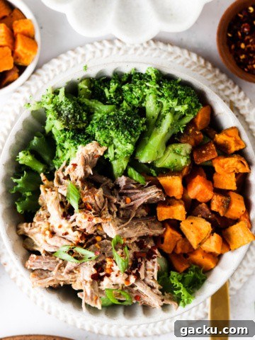 pork butt in a bowl with sweet potatoes and broccoli