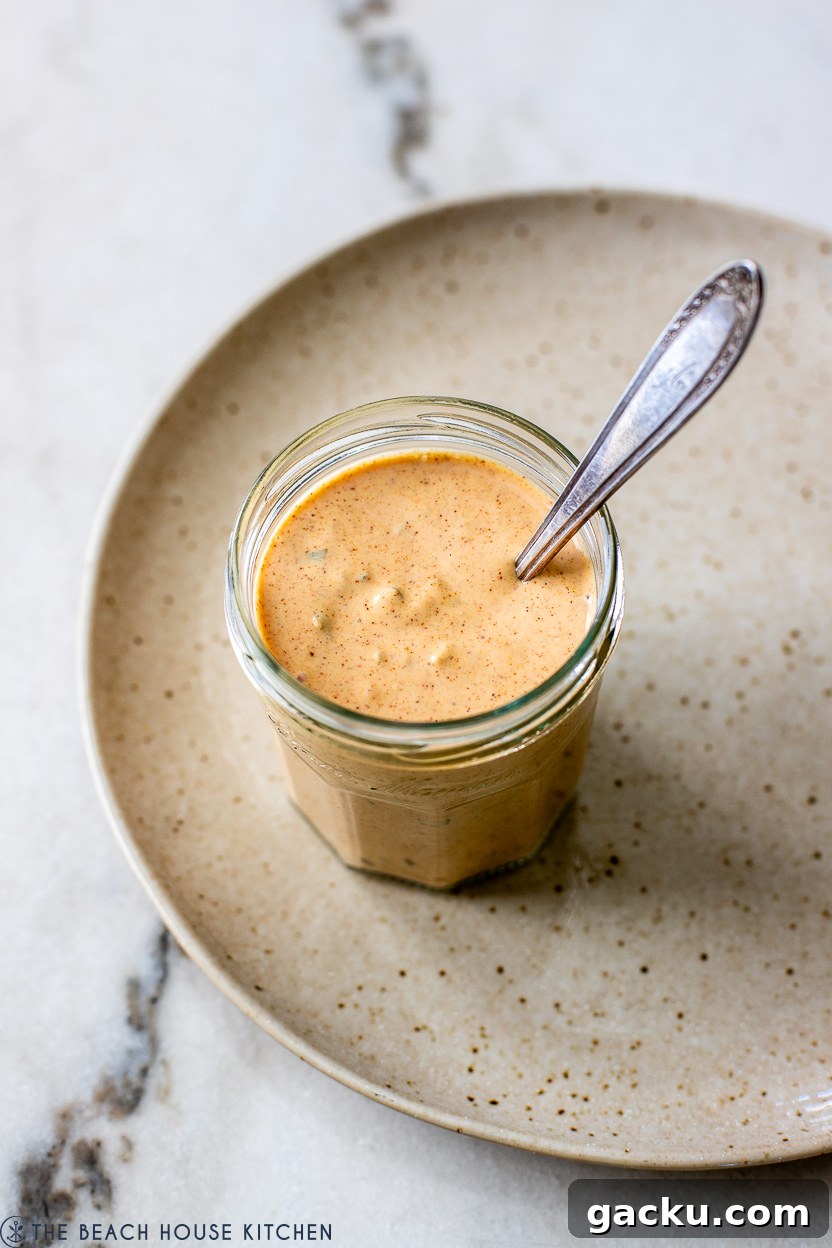 A jar of burger sauce on a plate
