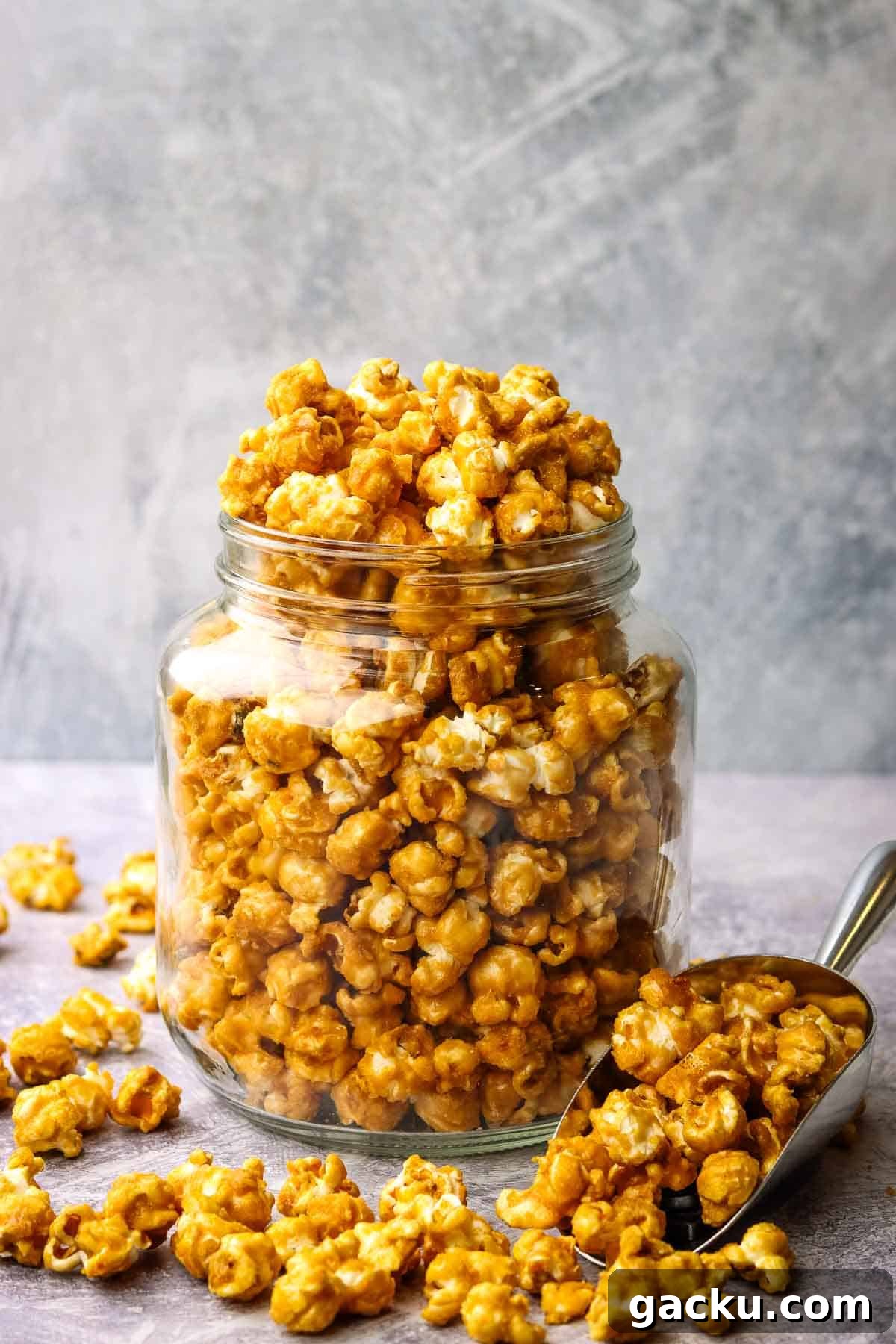 a jar overfilled with caramel corn. 